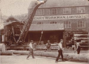 Sawmill staff pose for the camera along with one of the two steam cranes on site. This an early photo that pre-dates the devastating fire of August 1911. The mill was rebuilt with improvements made, including the installation of a large Paxman-Lentz stationary steam engine, this drove line shafts to various saws in the main building.